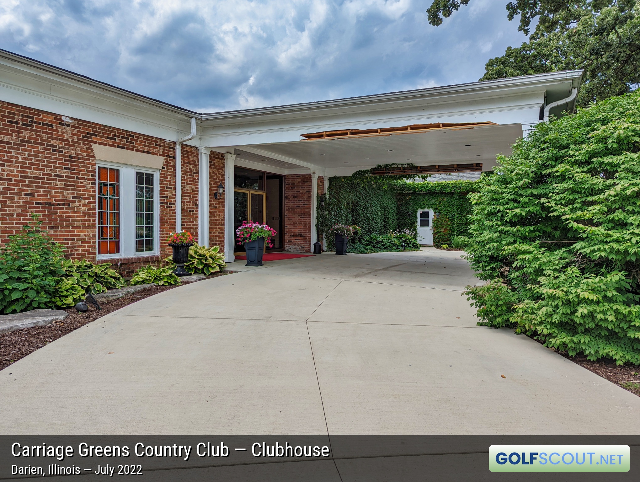 Photo of the clubhouse at Carriage Greens Country Club in Darien, Illinois. I hope they fix the awning damage soon before any animals move in there.