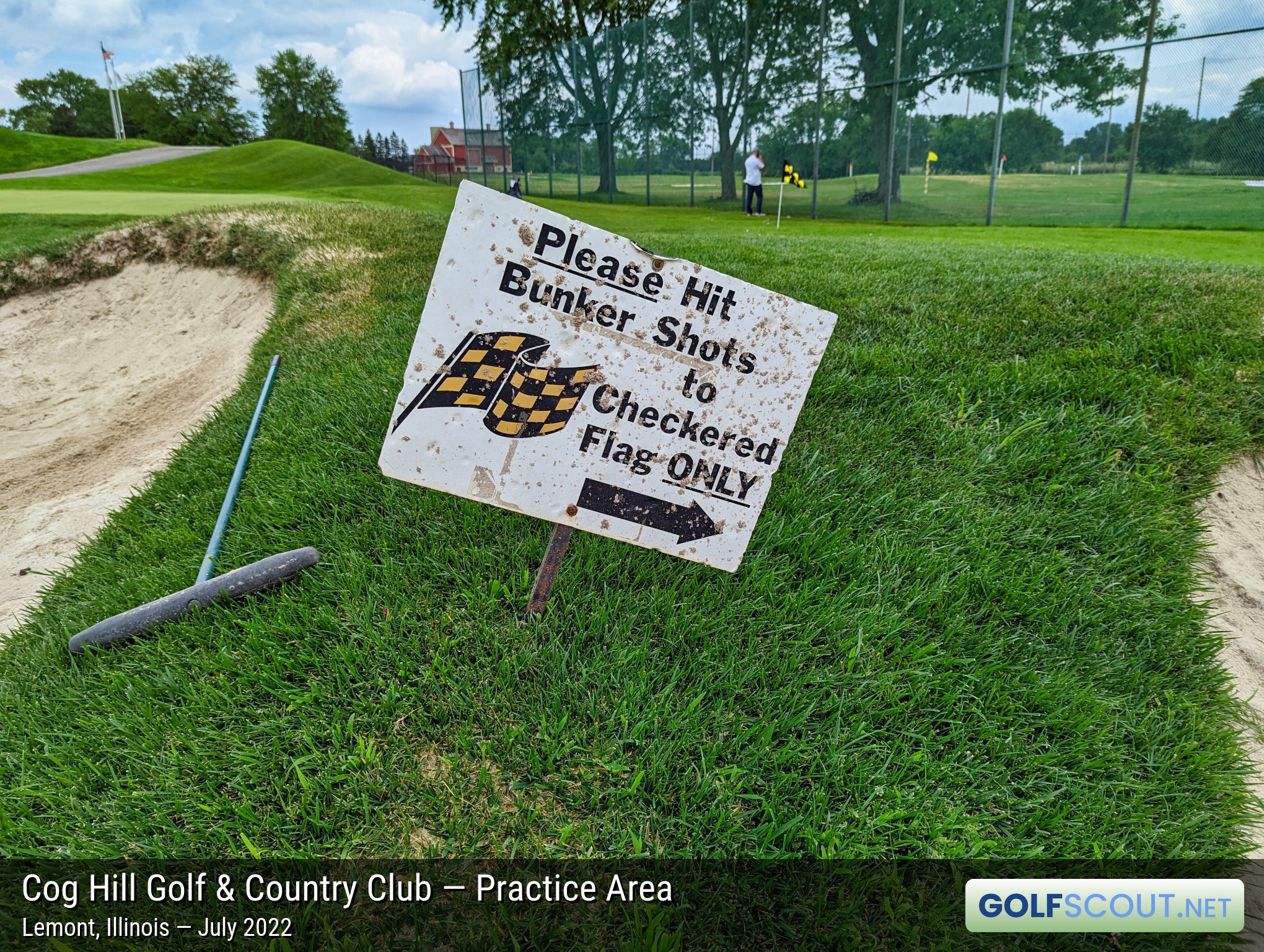 Photo of the practice area at Cog Hill Course #2 - Ravines in Lemont, Illinois. "Please hit bunker shots to checkered flag ONLY"