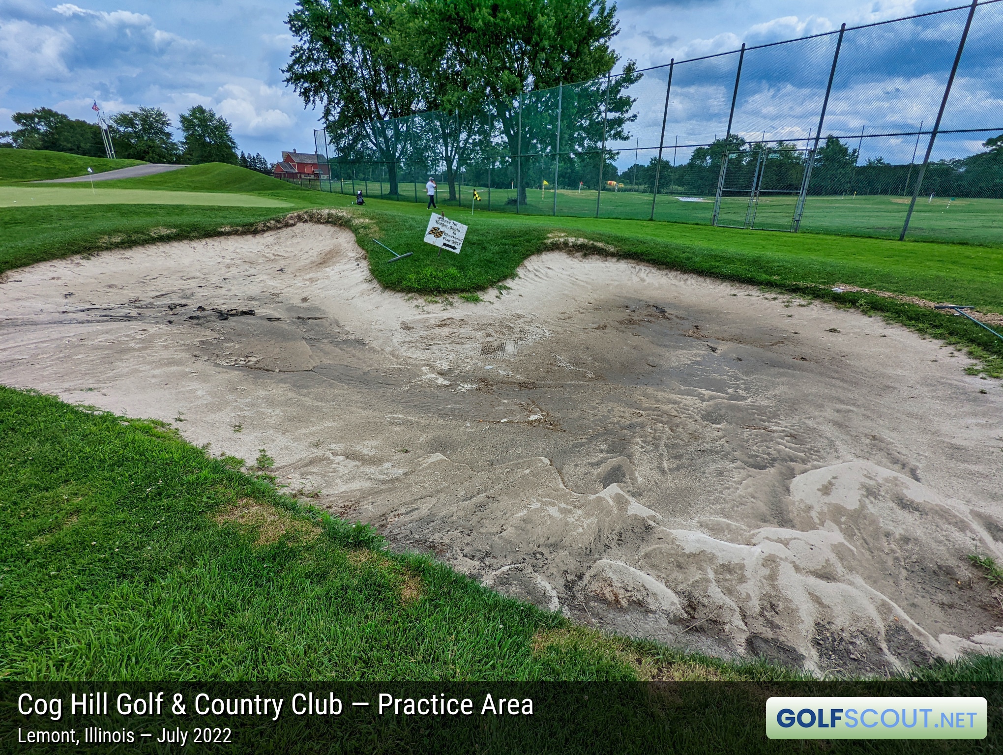 Photo of the practice area at Cog Hill Course #4 - Dubsdread in Lemont, Illinois. A practice bunker. It rained heavily the day before I visited Cog, so it's not in good shape in the photo. I've practiced here plenty before, it doesn't look like this generally.